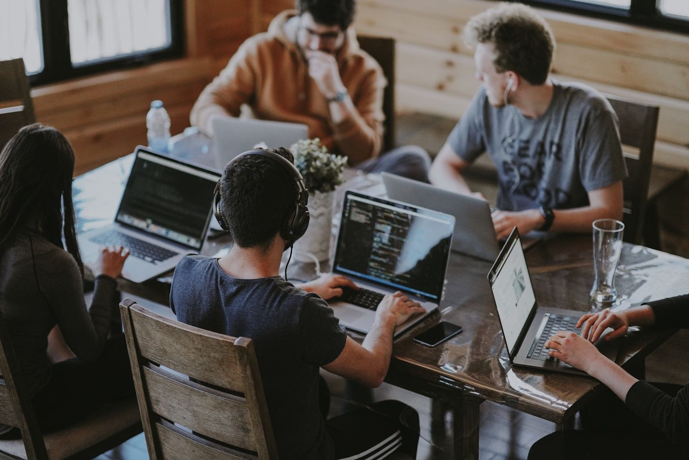 Team members joining hands in collaboration